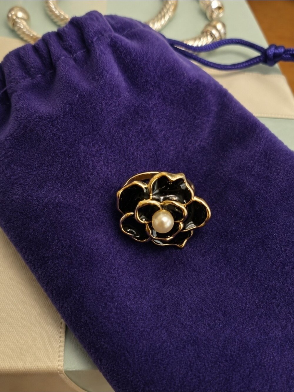 Gold-Tone Black Enamel Flower with Pearl Center